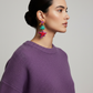 Editorial fashion photo with colorful star earrings